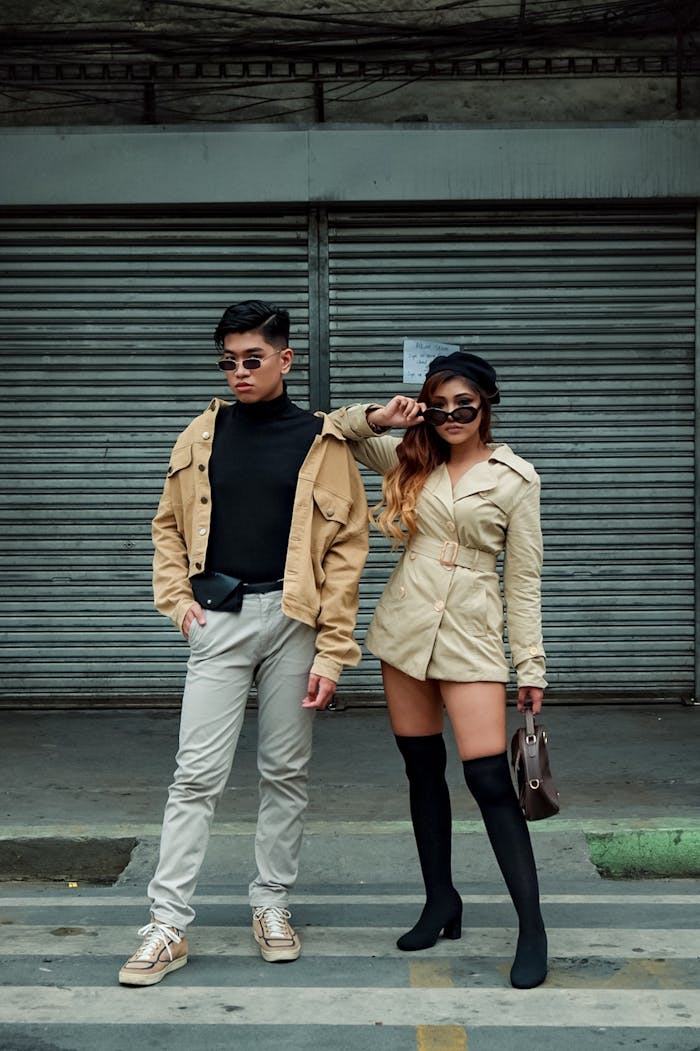 Home Stylish young adult models pose outdoors in urban setting.